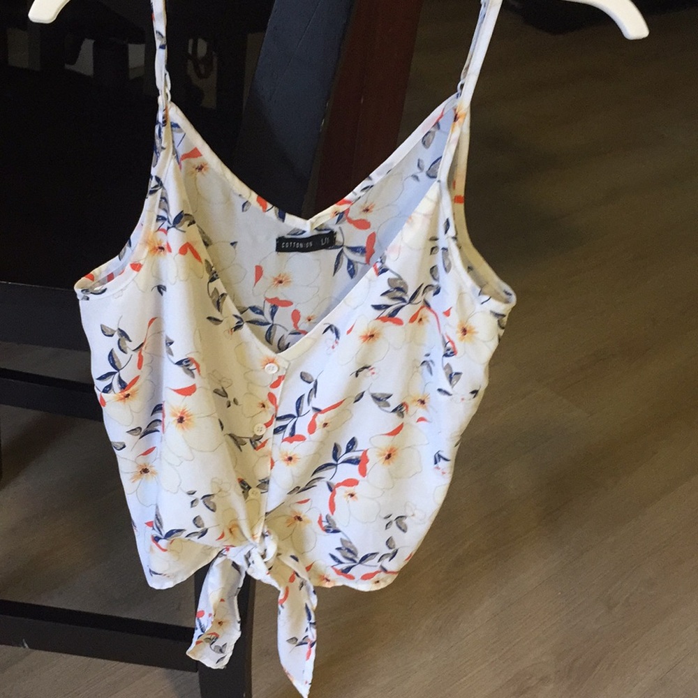 Spaghetti strap, flower shirt.